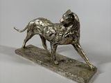 statue of a lion on a marble base