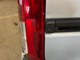 a close up of the tail light of a white truck