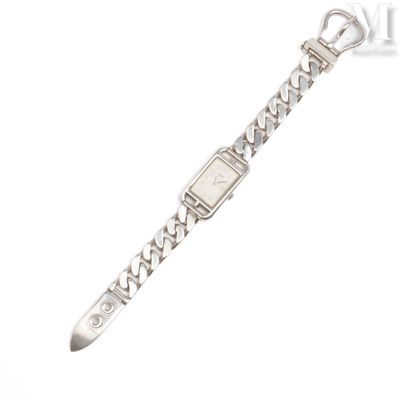 a close up of a wrist watch with a chain around it