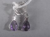 pair of amethorate and white topazte earrings on a white background