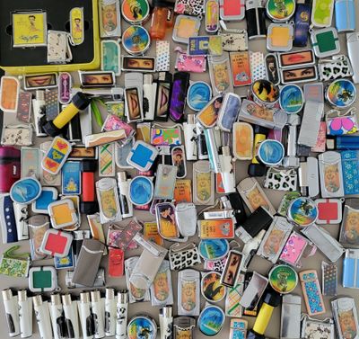 a pile of assorted magnets on a table