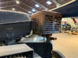 a close up view of an old truck in a garage