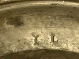 a close up of a silver plate with a name on it