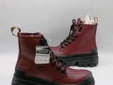 red leather boots with black soles and rubber outs