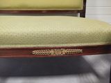 an image of a chair with a green upholstered seat