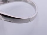 a ring with a diamond on it sitting on a table