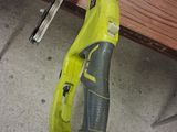 a yellow and black tennis racquet on the floor