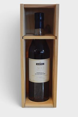 bottle of red wine in a wooden box on a white background