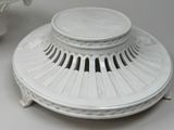 a white plate that has a lid on it