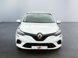 the front view of a white car parked in a room