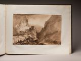an open book with a picture of a mountain scene in it