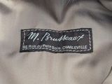 an image of a close up of a jacket with a label on it