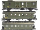 three green train cars stacked on top of each other