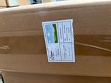 a cardboard box with a sticker on it sitting on a table