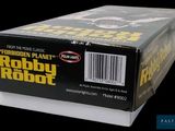 a box of roby robot toys on a black background