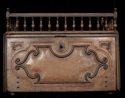 a wooden box with a decorative design on it