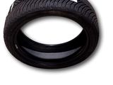 a close up of a tire on a white surface with a white background