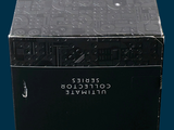a black box with a pair of scissors inside of it
