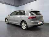 the back of a silver volkswagen e - golf parked in a garage