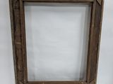 an old wooden picture frame with a white background