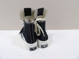 black converse sneakers with white laces are on a white surface