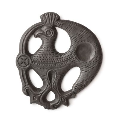 an image of a metal object with a bird on it