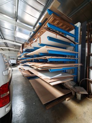 a truck that is parked next to a pile of wood
