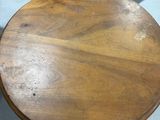 a table with a chair and a chair in the background