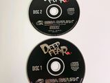two cds that are sitting on top of each other