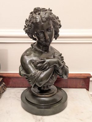 a statue of a woman holding a baby in her arms