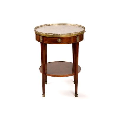 an image of a round table with a glass top and a wooden base