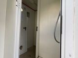 a bathroom with a toilet and a shower in it