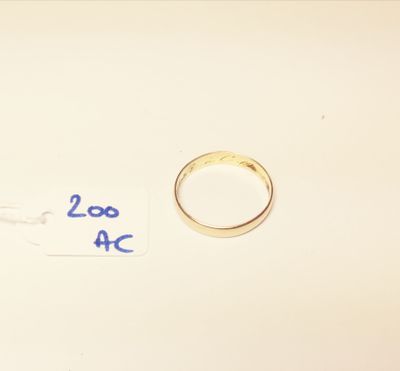 two wedding rings on a table with a price tag