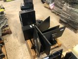a lot of computer monitors sitting on pallets in a warehouse