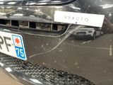 a close up of a car with a sticker on it ' s bumper