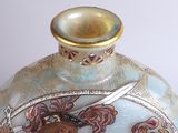 a vase that has a picture of a man on it