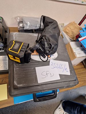 a table with a lot of items on it and a sign on it