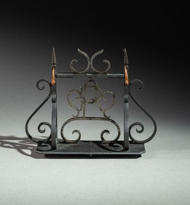 a small metal sculpture of a horse on a stand
