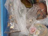a blue container filled with assorted items sitting on a table