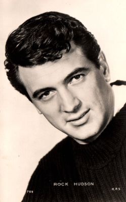 black and white photograph of a man in a sweater posing for a picture