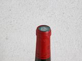 a bottle of wine that is sitting on a table