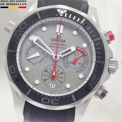 a close up of a watch on a white surface