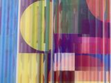 a picture of a colorful abstract painting on the wall