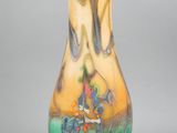 a glass vase that is sitting on a table