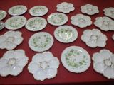many plates that are sitting on a red table