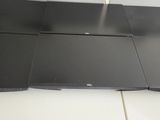 two laptops sitting on top of each other on a table