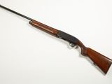 a rifle with a wooden barrel and a black handle on a white background