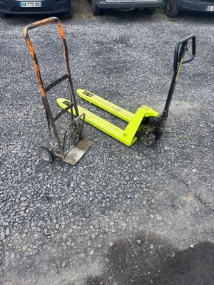 a small hand truck that is sitting in the parking lot