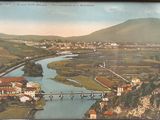 a picture of a picture of a river running through a town