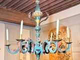 a chandelier that is hanging from the ceiling in the room